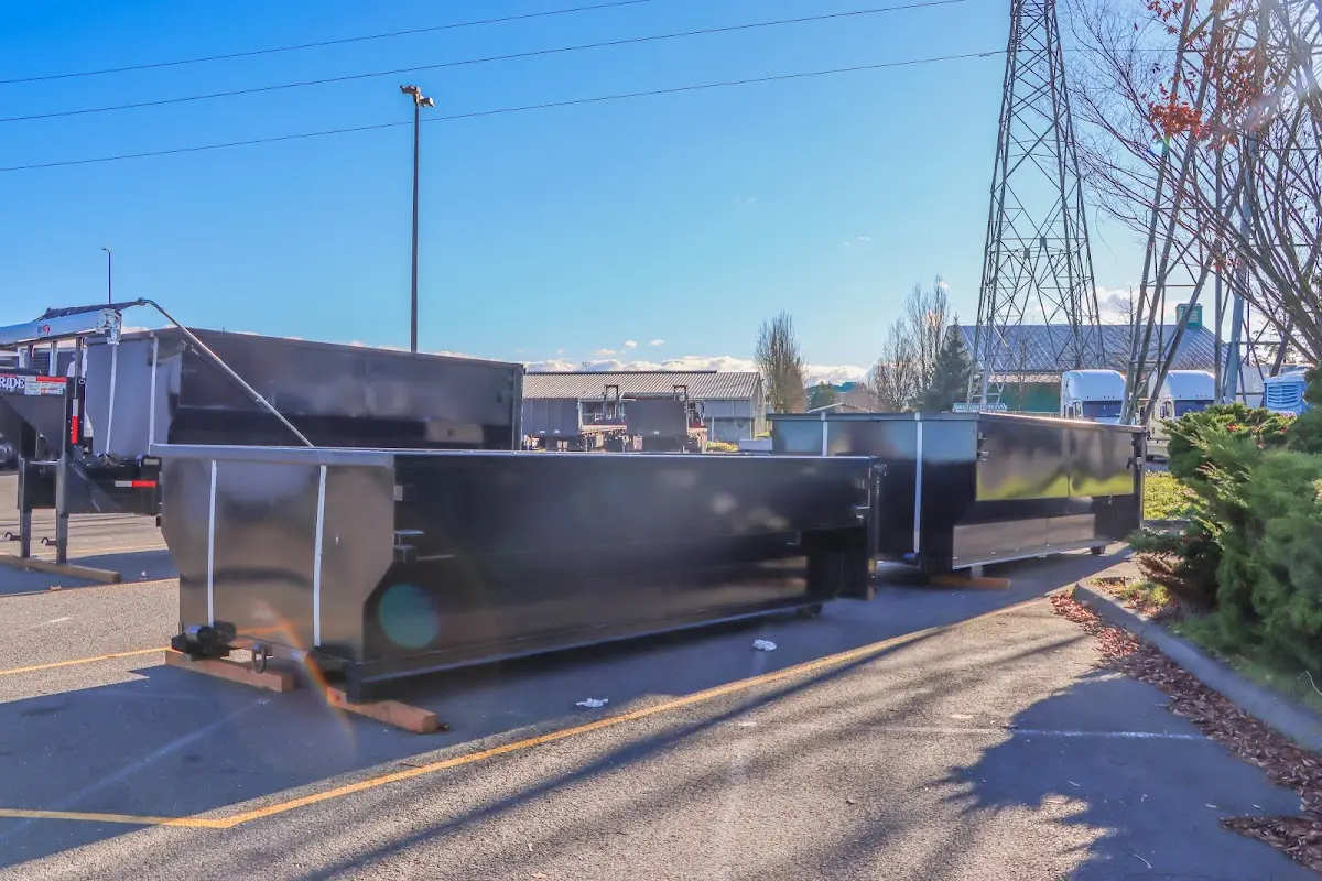 Roll-off dumpster ready for waste disposal at job site for Residential Dumpster Rental in Romulus